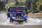 Mercedeze 4x4 rovering over the flowing water in Kaghan KPK
