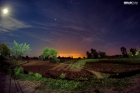 A view of fields and sky at night in the moonlight in Kohat KPK