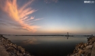 sky-clouds-bridge-reflect-in-still-water-at-dha-karachi
